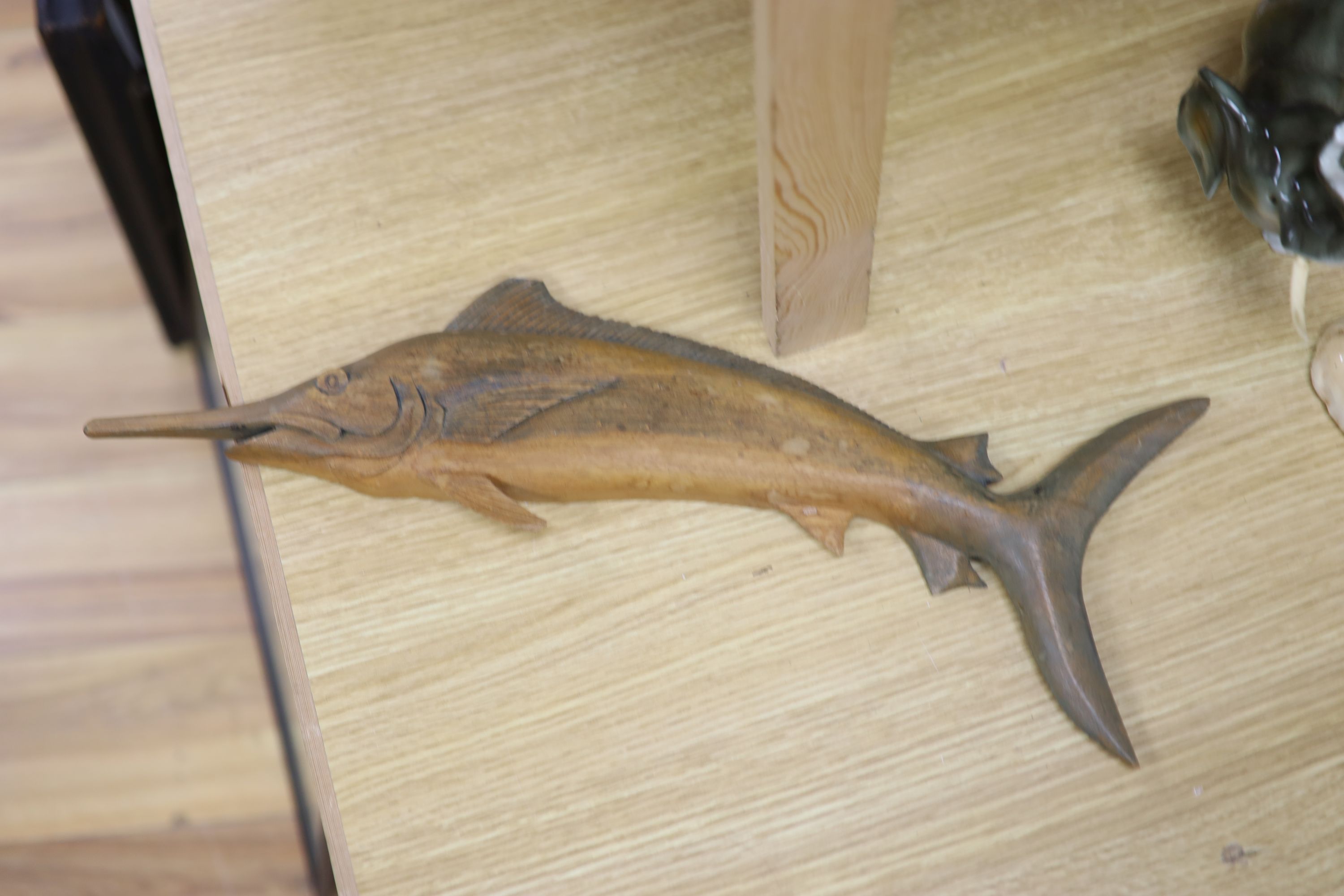 Three model ships: The Cutty Sark, The USS Constitution and Fragata, together with a carved wood Marlin